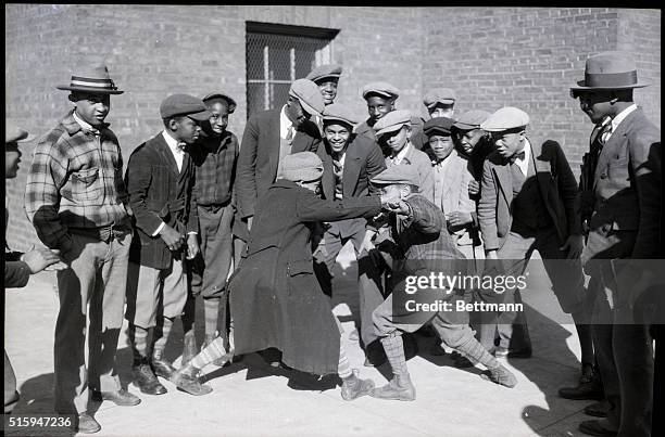 Harlem: Negro boys having a friendly dispute.