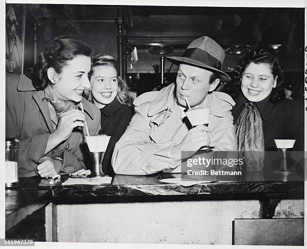New York, NY: Richard Widmark, whose forte in screen roles is rough and tough roles, steps out of screen charecter for a moment to indulge in an...