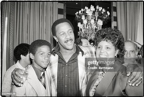 New York, NY- Pittsburgh Pirates' Willie Stargell puts his arms around Mrs. Roberto Clemente and Roberto, Jr., widow and son of Stargell's former...