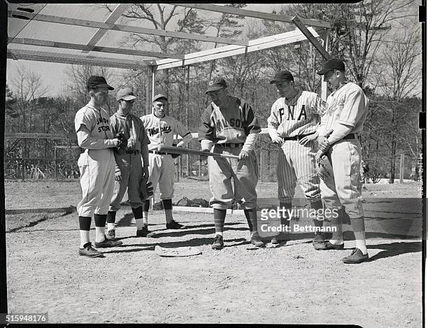 Hot Springs, AR: Ray Doans' Baseball Camp. Rogers Hornsby, insructing the boys how to bunt: Enior Dunkin, Warren, Ohio, Alan Danielson, Waupoca, MI,...
