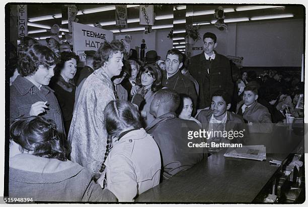 Woman unable to find a vacant seat at a F.W. Woolworth's lunch counter, chastises demonstrators participating in a sit down protest at the counter.