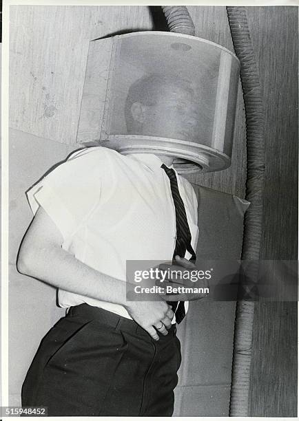 Norwegian physiologist Harald Andersen tests breathing equipment before travelling to study the breathing of the Hottentots and Bushmen of the...