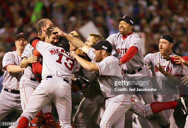 The Boston Red Sox celebrate after defeating the St. Louis Cardinals 3-0 in game four of the World Series on October 27, 2004 at Busch Stadium in St....