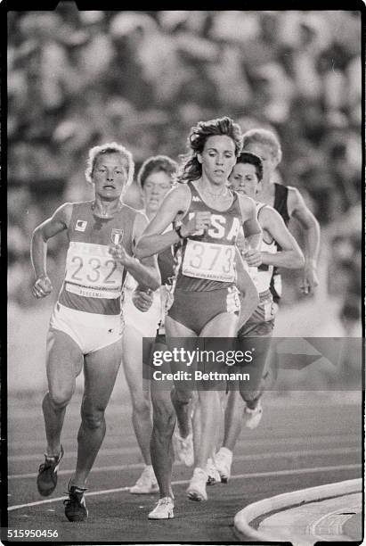 American runner Mary Decker takes the lead from Italy's Agnese Possamai on her way to victory in a heat of the women's 3000-meter run at the 1984...