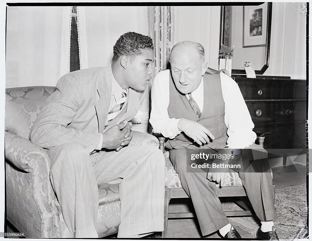 Boxer Joe Louis Talking With Fight Promoter