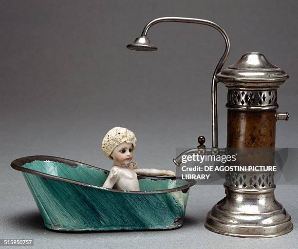 Prototype of spirit operated toy water heater with bath and baby. 20th century. Milan, Museo Del Giocattolo E Del Bambino