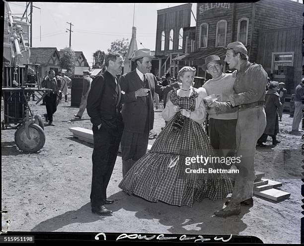 Winner! Randolph Scott in movie makeup gets a big kick out of cabled news from his wife, the former Marion DuPont Somerville, that her horse...