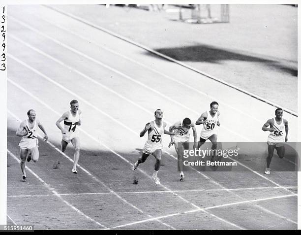 Melbourne, Australia: Robert Morrow breaks the tape to wine the 100 meter finals with a winning time of 10.5 seconds. Second was Walter Baker USA,...