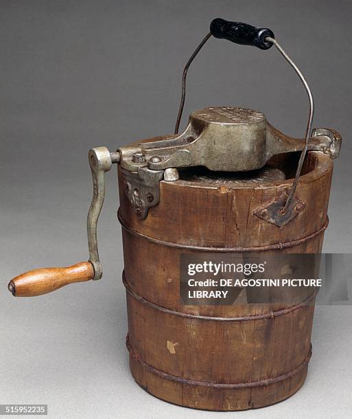 Wooden ice cream maker with hand crank toy. United States of America, 20th century. Milan, Museo Del Giocattolo E Del Bambino