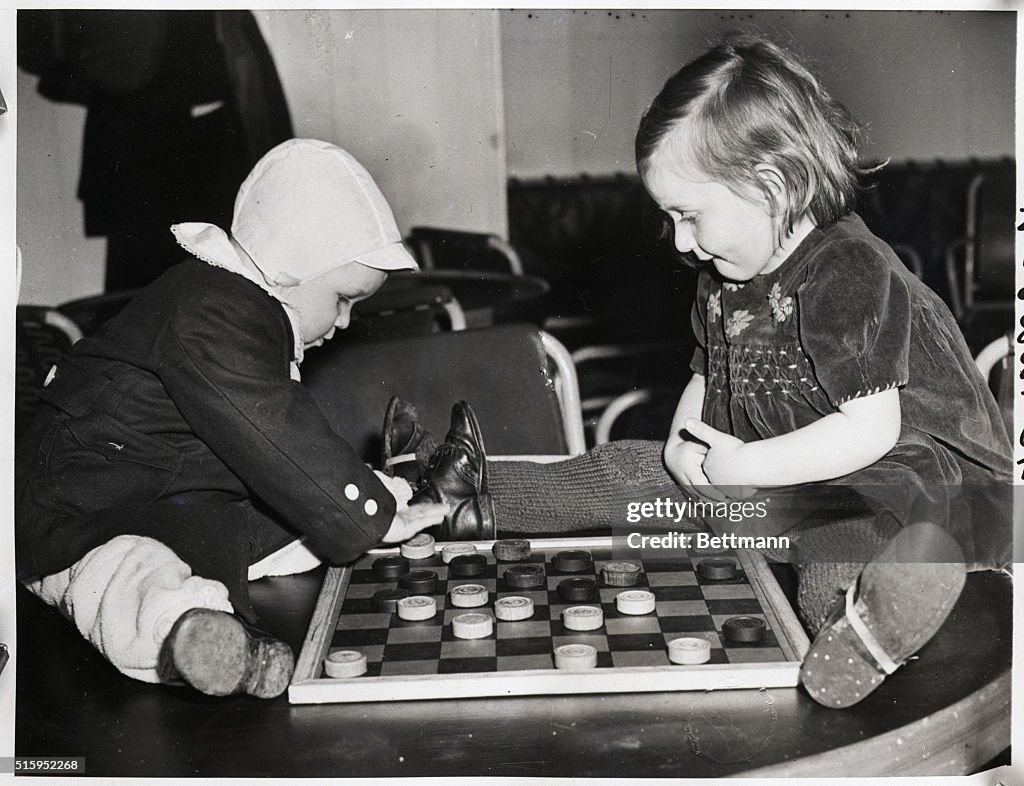 Small Children Playing Checkers