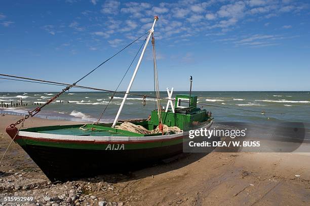 Boat on a beach on the Baltic Sea coast near Ventspils, Courland, Latvia.