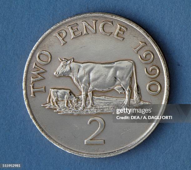Pence coin reverse, cow and calf. Guernsey, 20th century.