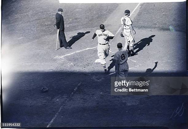 St. Louis, MO: Rudy York, of the Boston Red Sox, crosses home plate with the first run of the 1946 World Series in the second inning of the opening...