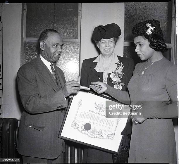 Philadelphia, PA- Marian Anderson receives the Liberian Order of African Redemption form Walter Walker, Liberian Consul General, at a ceremony in...