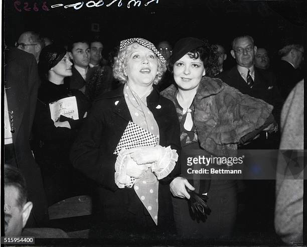 Hollywood, CA- Two famous screen sirens, Clara Bow and Mae Murray, stand, as is the custom before a main event at the Hollywood Legian Stadium. Mae...
