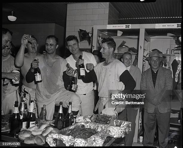 Milwaukee,WI: Milwaukee dressing room after the Braves beat the Cardinals, 4-2, to clinch the National League Pennant. Toasting the victory with...