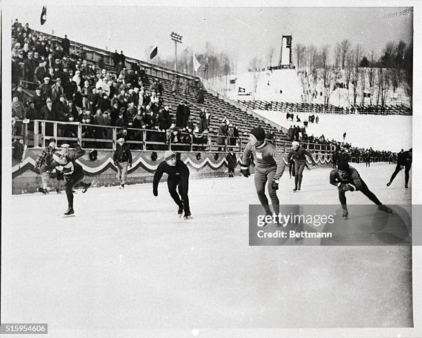 Lake Placid, NY- Pictured in this view of the second heat, re-run 10,000 meter race finish are: Irving Jaffe of the U.S., 1st; Frank Stack of Canada,...