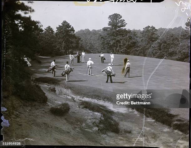 Clementon, NJ- Members of the British Walker Cup team pictured on the fifth green of the Pine Valley Golf Course near here, as they tried to "get the...