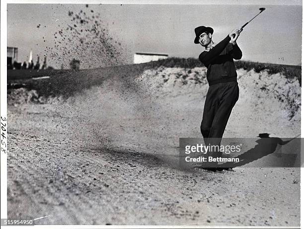 Pinehurst, NC- Ray Mangrum, who is at Pinehurst, NC, practicing for the forthcoming P.G.A. Tournament, is shown as he blasts one from the trap at the...