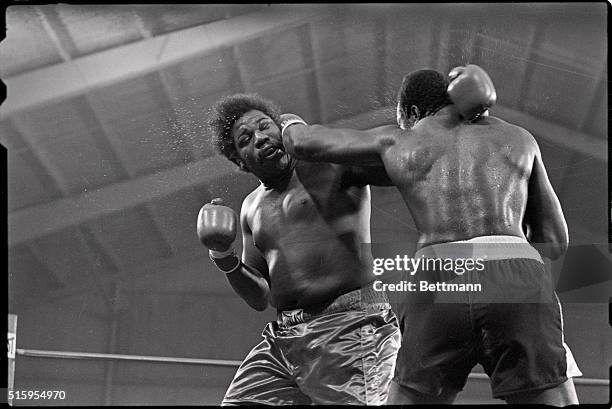 Las Vegas, NV- Larry Holmes and Leroy Jones exchange punches during early action 3/31 at Caesar's Palace during WBC heavyweight title bout. Holmes...