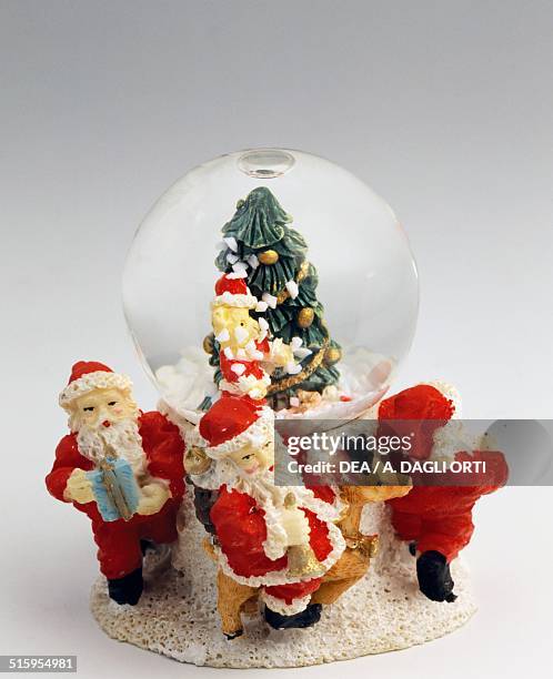 Ring a Ring o' Roses with Santas and Christmas tree, snowglobe. 20th century.