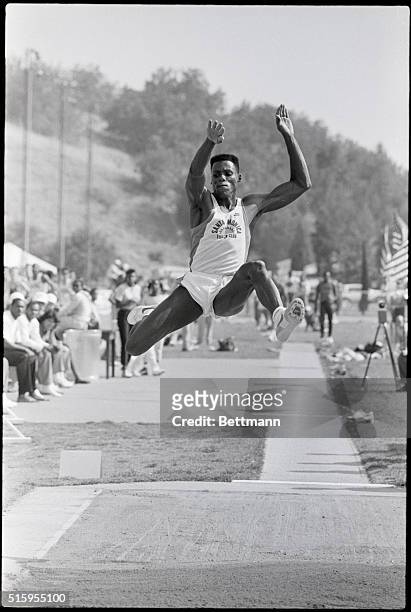 Walnut, CA- Olympic gold medal winner Carl Lewis leaps for a distance of 28'94" to win the long jump and set a new record at the Mt. SAC Relays.