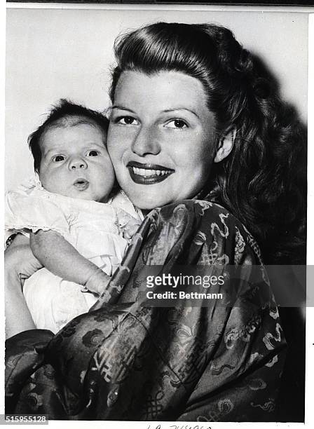 Hollywood, CA- Rebecca Welles, born December 17th gets some moral support from her beauteous mama, Rita Hayworth, as she makes her first camera...