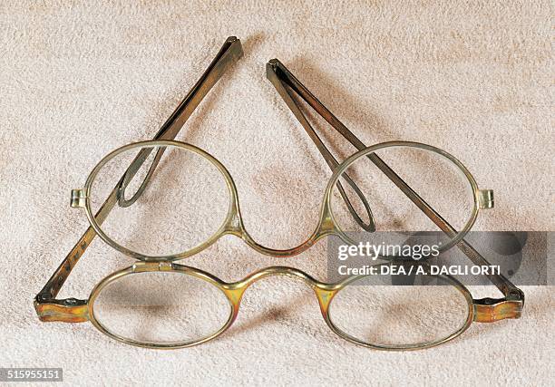 Silver spectacles with double stacking front cover, the first front cover, the fixed one, has lenses for myopia, the second, when overlaid corrects...