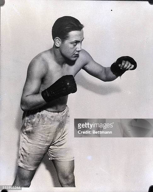 Adolf Wolfgast, lightweight boxing champion, shown in punching pose.
