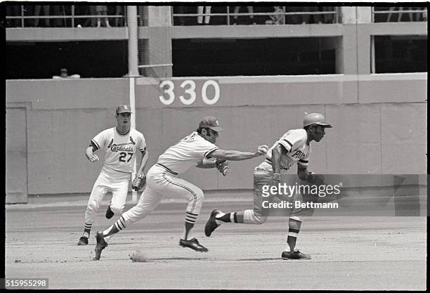 St. Louis, Missouri- St. Louis Cardinals' third baseman Joe Torre, , runs down and tags out Pittsburgh Pirates' Manny Sanguillen in the 2nd inning of...