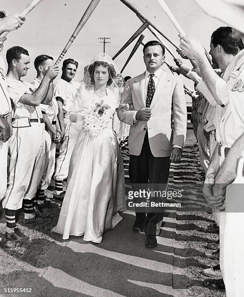 Ontario, CA: Guard of Honor--In a traditional baseball manner--is accorded Miss Dorothy Helen Riggins as she marches down the "Aisle" to home plate...