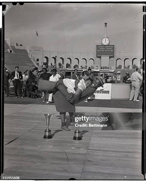 Los Angeles, CA: Win jitterbug honors- Ernstid Davidson, and Herman Harrison, a pair of Negro "hep-cats," showed their heels to all competition and...