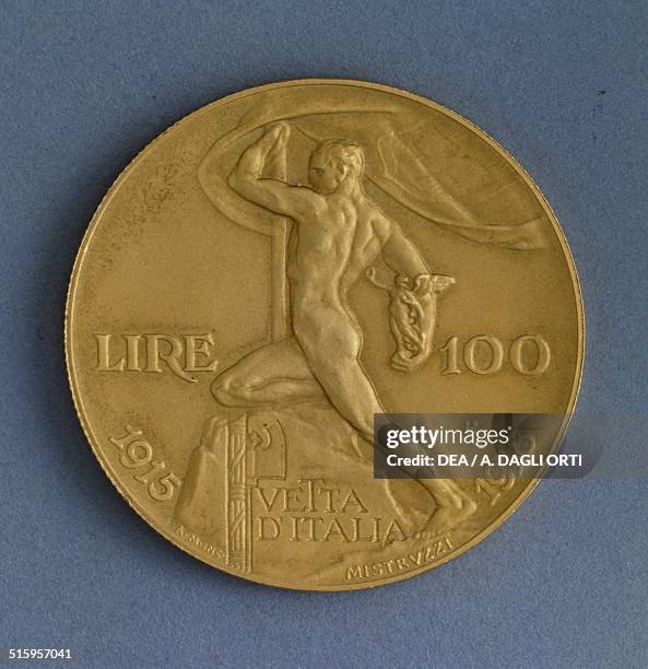 Lire gold coin also known as Vetta d'Italia celebrating the 25 years of the reign of Victor Emmanuel IIII, reverse, male figure holding a flag and...