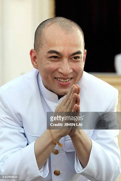 Cambodia's new King Norodom Sihamoni greets the crowd during ceremonies at the Royal Palace in Phnom Penh, 28 October 2004. Traditional religious...