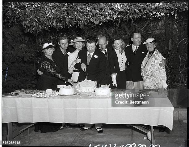 Mrs. James Gleason, Ben Alexander, Anita Louise, Frank McHugh, Jimmy Gleason, Ginger Rogers, Pat O'Brien, and May Robson pose at Frank McHugh's...