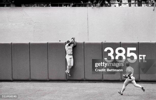 New York, NY - Seattle mariners centerfielder Ken Griffey jr. Leaps and reaches over the wall and grabs the ball robbing yankees Matt Nokes of a 2...