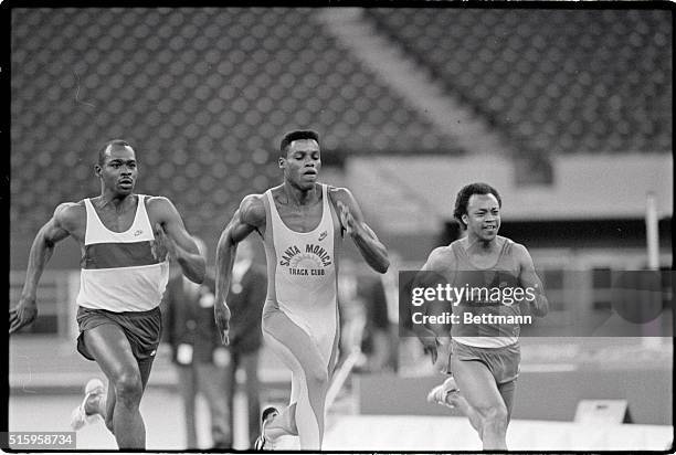 Indianapolis, IN- Carl Lewis closes his eyes as he nears victory over Albert Robinson of Indiana University in the 60M dash at the Hoosier Dome...