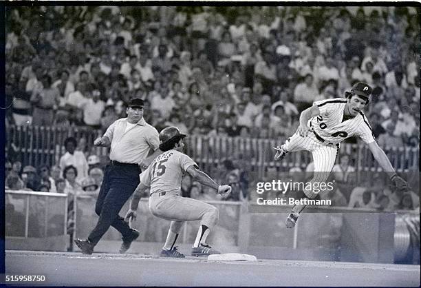 Philadelphia, PA- Phils' third baseman Mike Schmidt leaps in a vain attempt to take Phils' catcher Bob Boone's pick-off throw to third on Dodgers'...