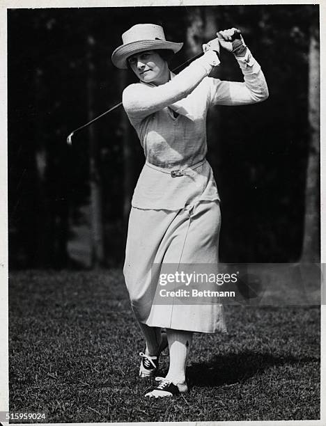 Mrs. Thomas Hucknall playing golf. Undated photograph.