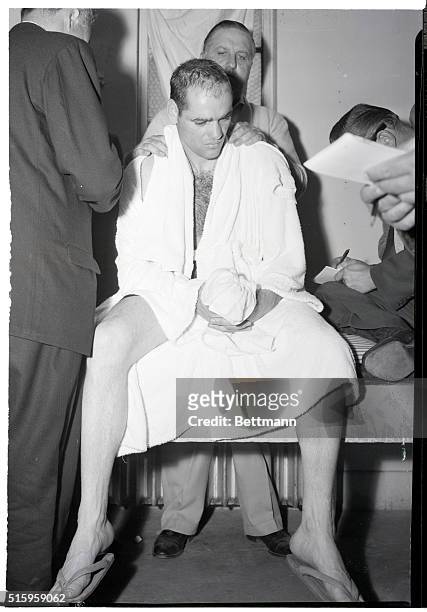 Los Angeles, CA- Carl "Bobo" Olson sits dejectedly in his dressing room at Wrigley Field May 18th aftre losing the middleweight championship bout to...