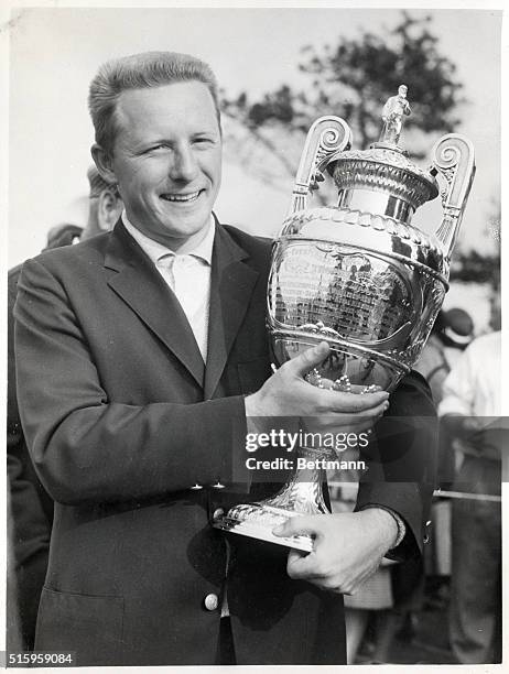 Sandwich, England- Smiling broadly, Deane Beman, the golfing whiz from the University of Maryland, holds his trophy here May 30th after winning the...