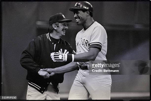 Minneapolis, MN-New York Yankees manager Billy Martin congratulates Dave Winfield after Winfield's first-inning home run against the Minnesota Twins...