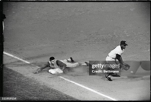 Los Angeles, CA- Cincinnati's Pete Rose slides headfirst into third in the 8th inning, getting there on a wild pitch of Dodger Joe Moeller's. Catcher...