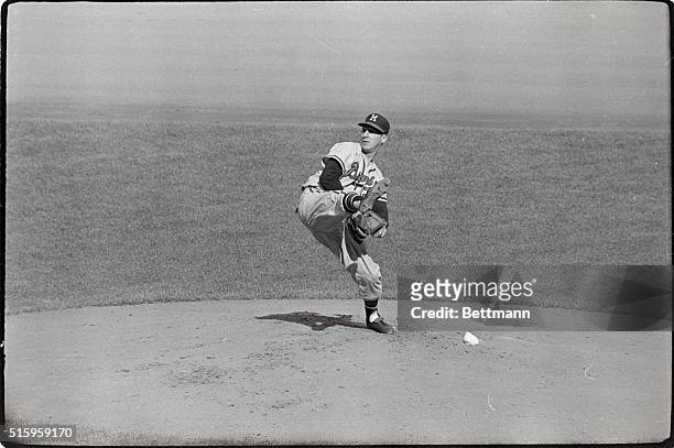 Bronx, NY- The sequence camera catches the form of Milwaukee Braves pitcher Warren Spahn as he pitches a two hitter against the New York Yankees in...
