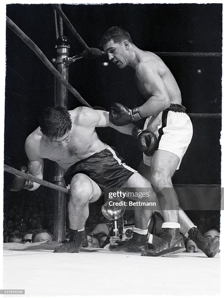 Rocky Marciano Punching Boxer in Corner