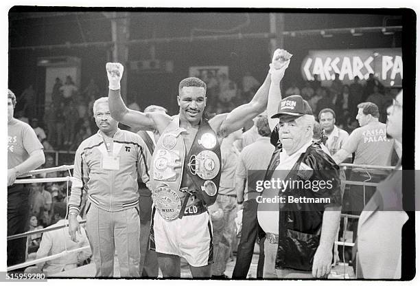 Las Vegas, NevadaEvander Holyfield raises his arms and proudly displays his three cruiserweight belts after defeating WBC titlist Carlos DeLeon in...