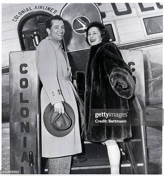 New York, NY- Having just arrived in New York from the West Coast, Norman Shearer and her husband, Martin Arrouge, prepare to board a plane at La...