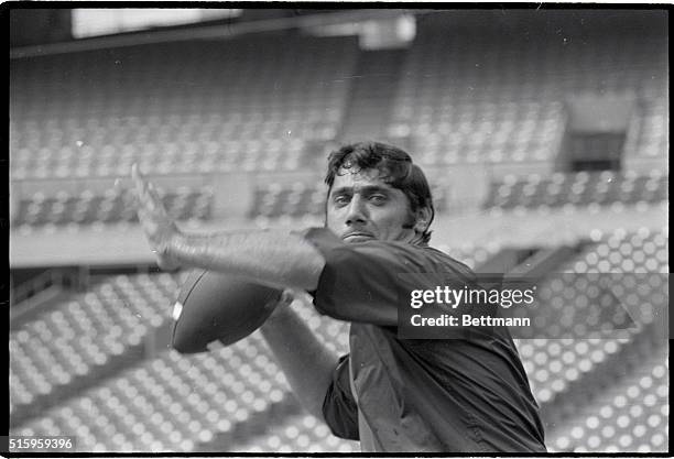 St. Louis, Missouri- New York Jet's quarterback Joe Namath tones up at Busch Memorial Stadium for the Jets-St. Louis Cardinals Glennon Memorial Game....