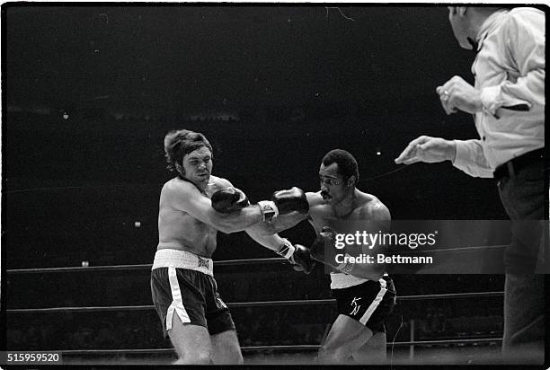 New York, NY- Ken Norton connects with a right to the head of Jerry Quarry in the first round of their scheduled 12 round heavyweight elimination...