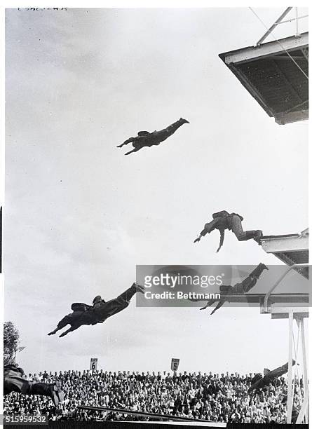 Halberstadt, Germany-German soldiers in a spectacular dive while wearing full field equipment were a feature of the Olympic Trials.